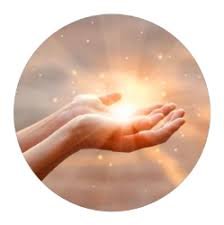 Glowing light held between two hands symbolizing karmic energy